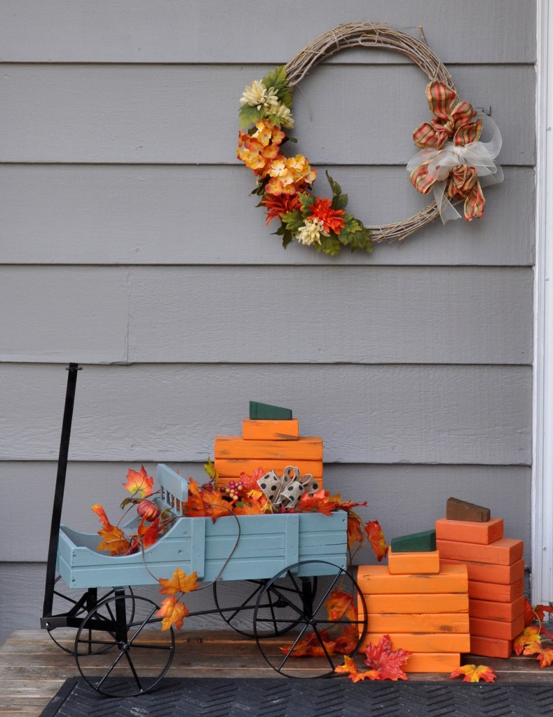 Outdoor Thanksgiving Decor, wood pumpkins, outdoor fall decor, decorating outside for fall, fall wreaths, autumn wreaths, thanksgiving wreaths